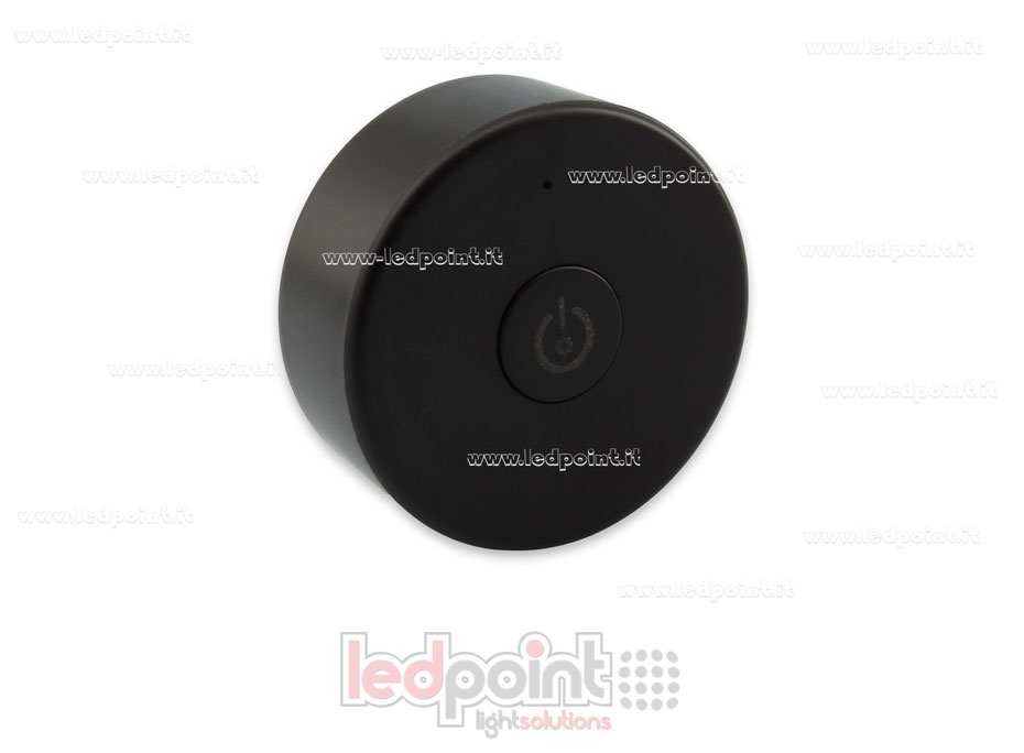 Telecomando portatile monocromatico, nero, RF 2.4G, con magnete sul retro e fori per fissaggio a muro Telecomando portatile monocromatico, nero, RF 2.4G, con magnete sul retro e fori per fissaggio a muro